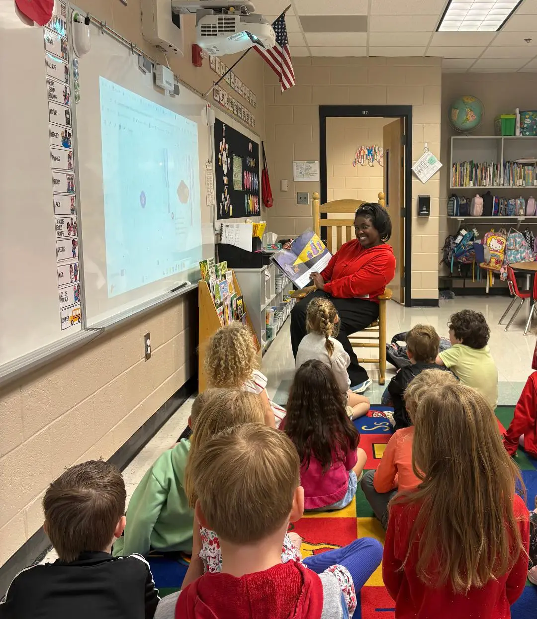 Dr. Kay Howell with students and supporting early literacy in North Fulton.